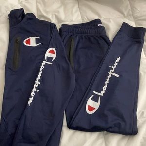 Champions track suit in Navy blue. Size medium.